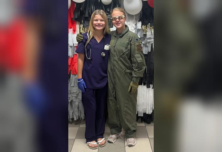 Paige Nicholson and Tynnlie Schram dress as a nurse and pilot as part of The Game of Life on Tuesday.